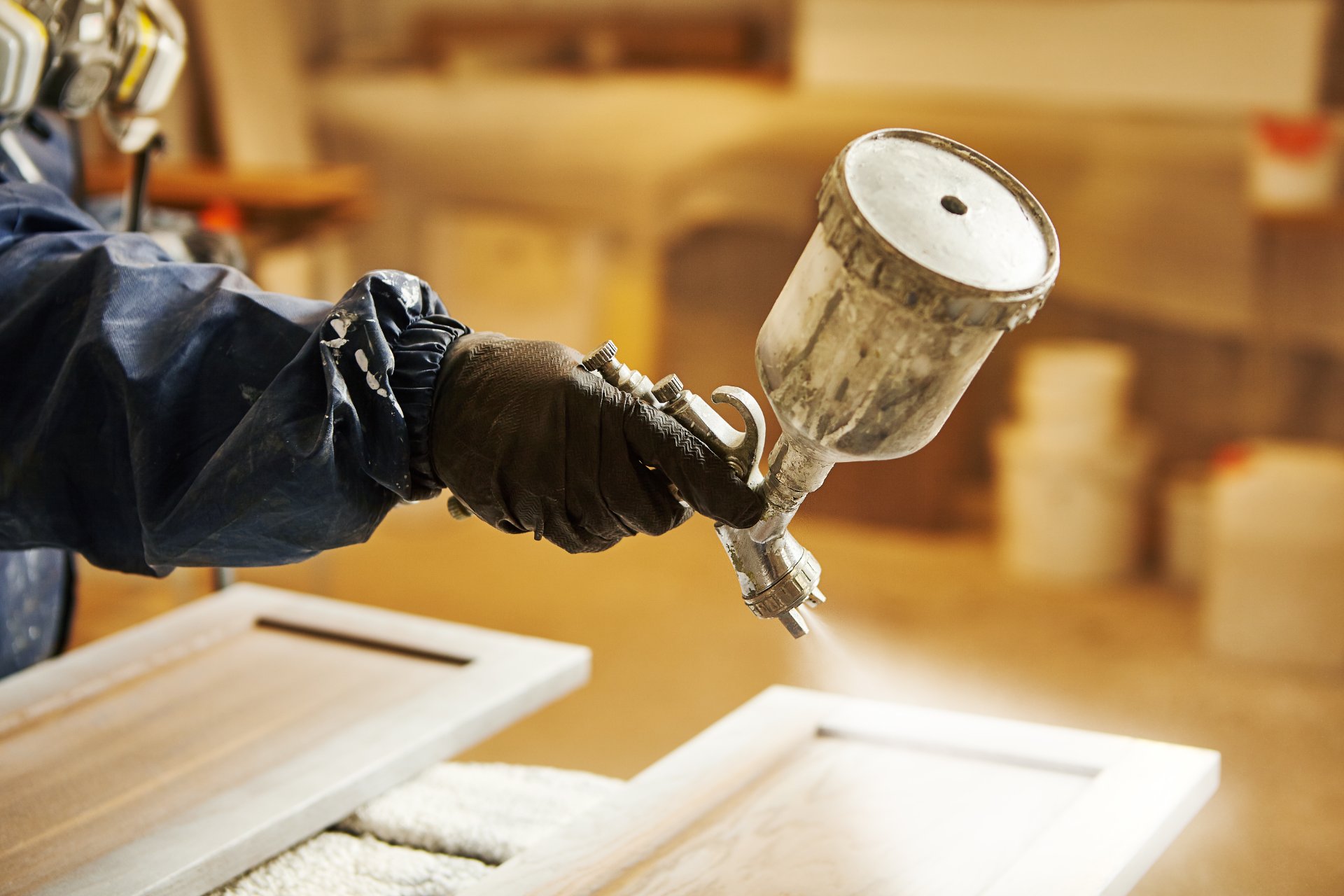 Spraying finish onto a cabinet door