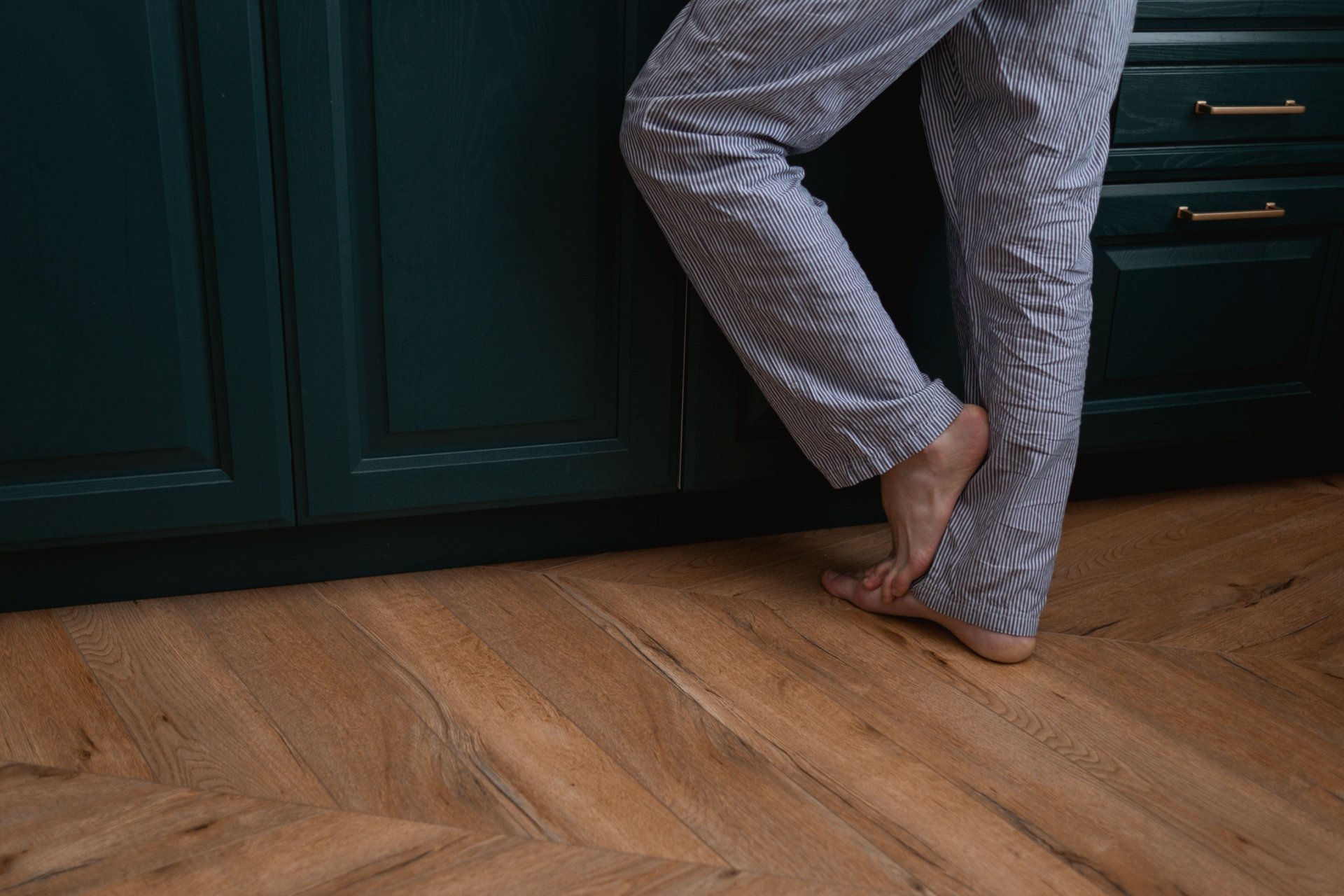 Chevron wood flooring in a finished kitchen