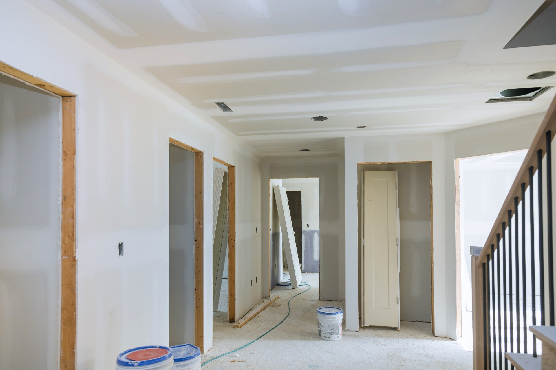 Interior of a home mid-remodel with fresh drywall