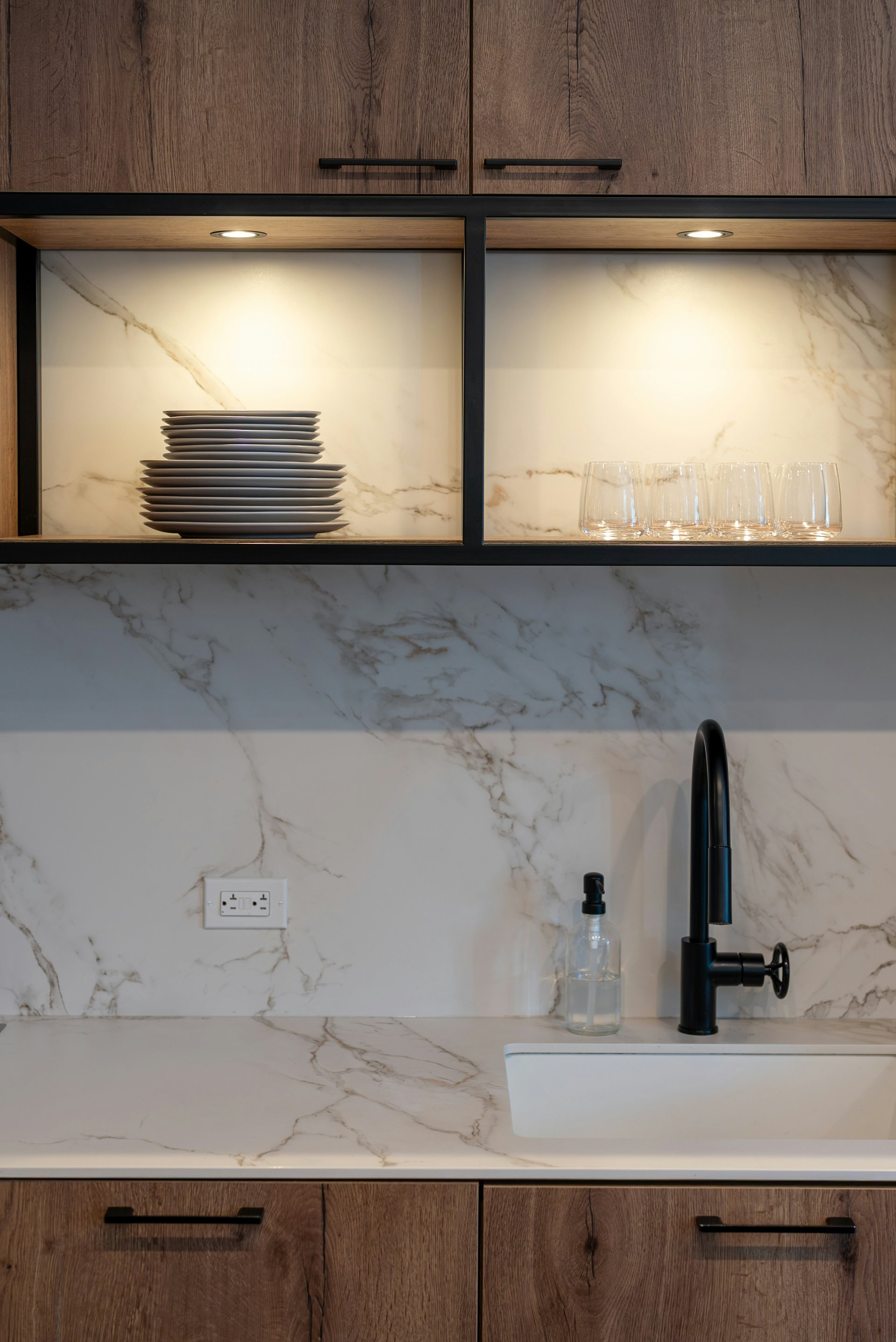 Marble backsplash with lit display shelving