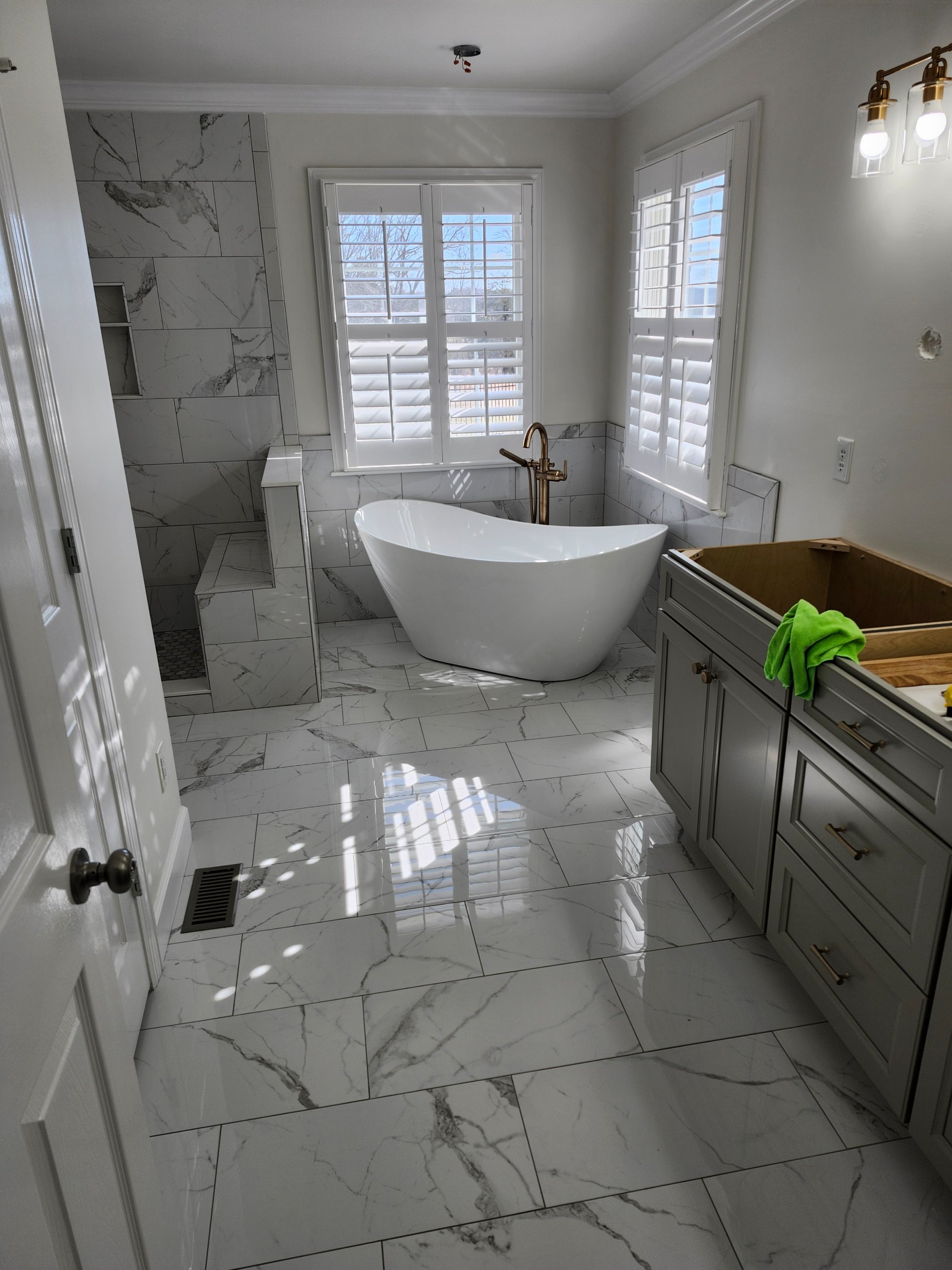 Marble tile flooring in a finished bath