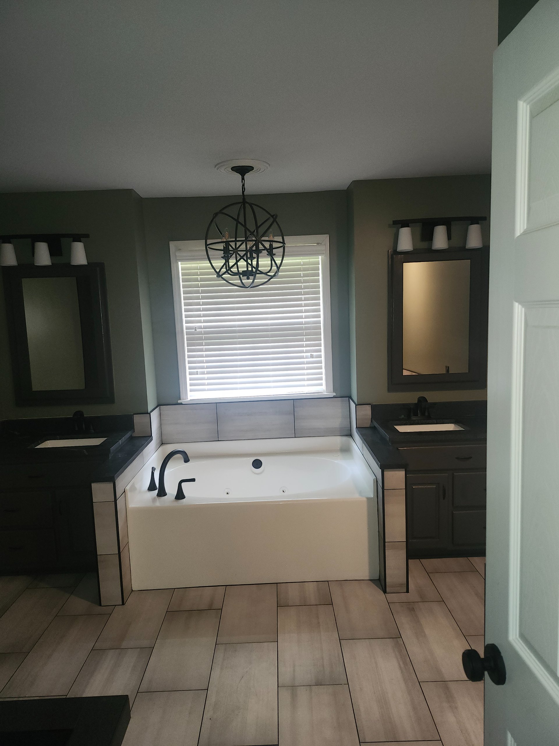 Secondary bathroom with double vanity and soaking tub