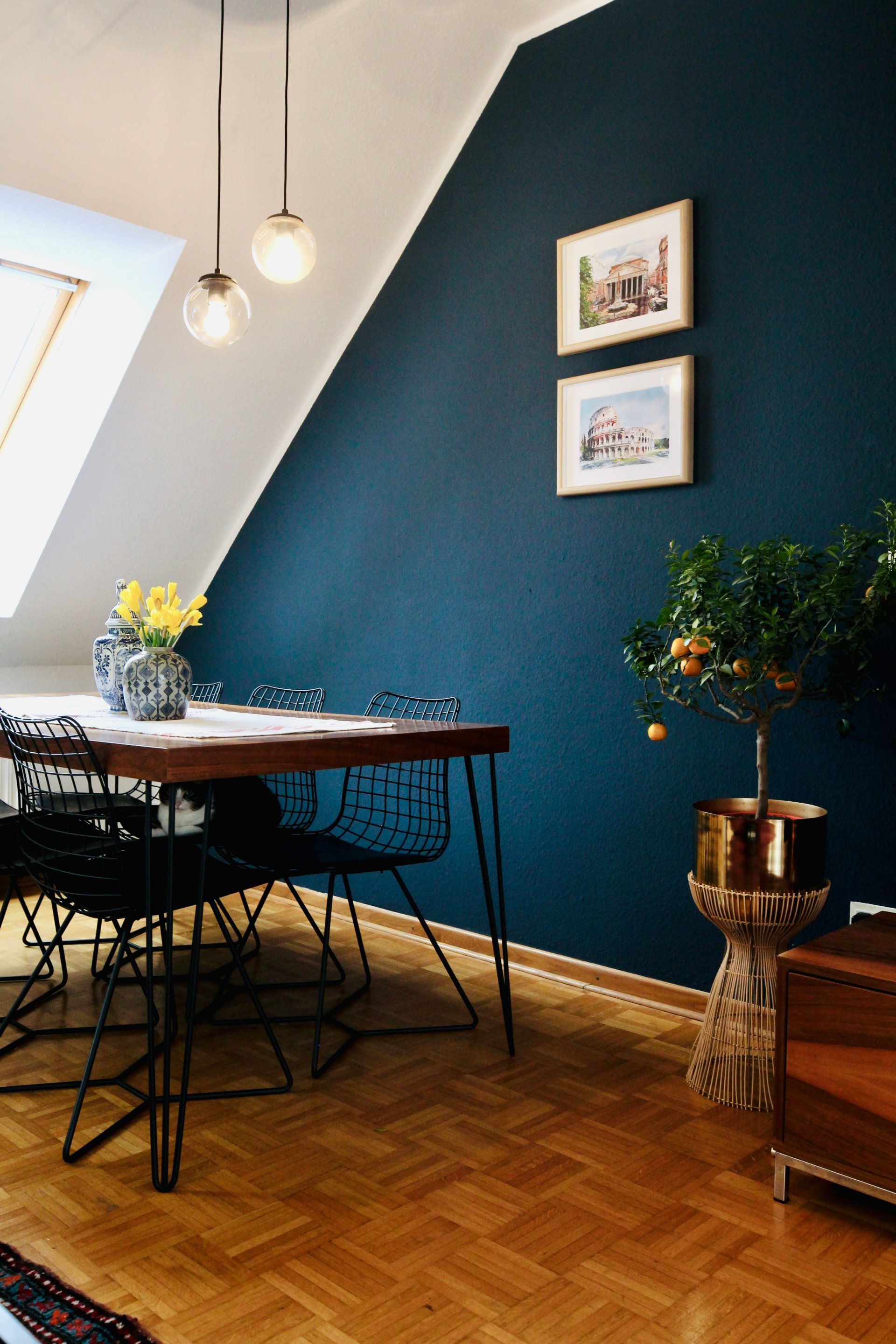 Deep navy accent wall in a freshly painted dining room